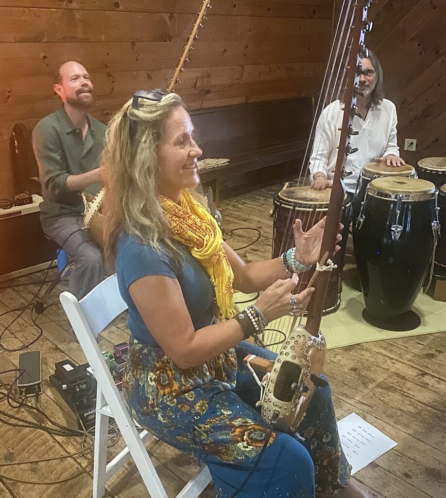 Colin Allured leading live music and Mantra Dance, with retreat participants accompanying the live music sessions.