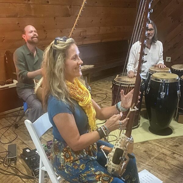 Colin Allured leading live music and Mantra Dance, with retreat participants accompanying the live music sessions.