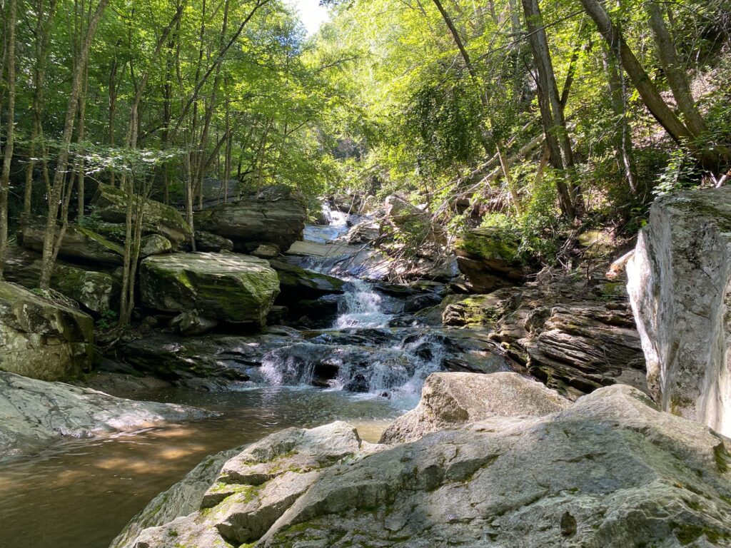 Valle Crucis waterfall in the Blue Ridge Mountains, North Carolina — retreat setting for breathwork and community.